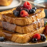 Crispy sourdough French toast with maple syrup and berries