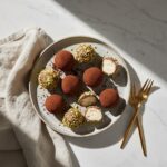 Delicious cream cheese chocolate truffles on a stoneware plate
