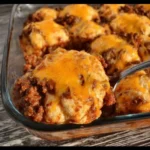 Cheesy Sloppy Joe Ground Beef Casserole served in a dish with toppings