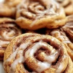 Delicious Cinnamon Roll Cookies with icing on top, fresh from the oven.