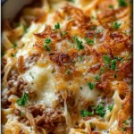 French Onion Ground Beef Casserole served in a baking dish, garnished with cheese.