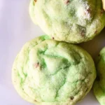 Freshly baked pistachio pudding cookies on a cooling rack.