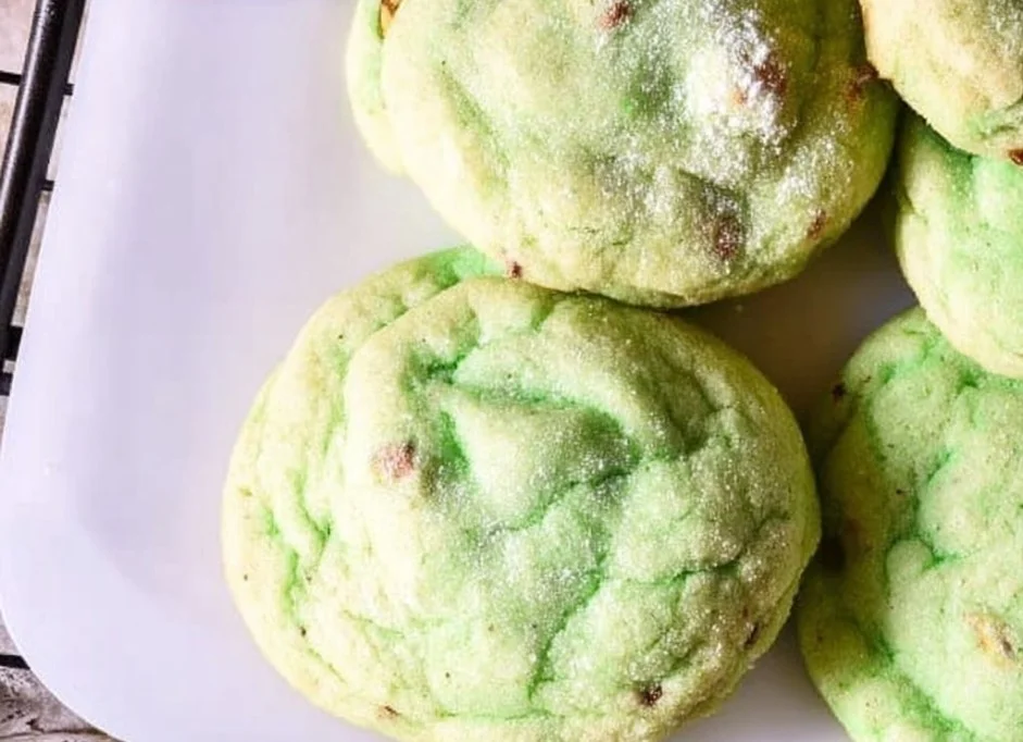 Freshly baked pistachio pudding cookies on a cooling rack.