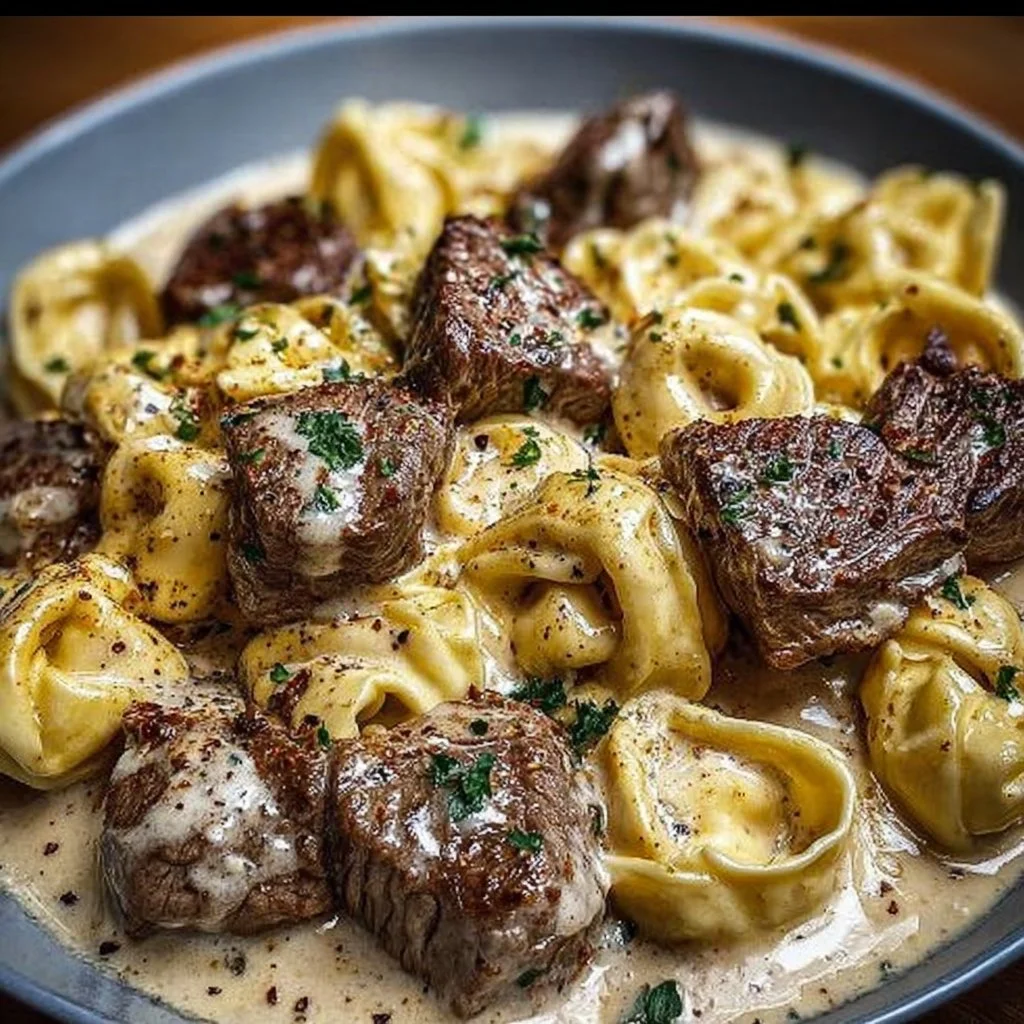 Cracked Garlic Steak Tortellini served in creamy sauce with fresh herbs