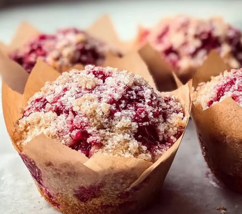 Freshly baked Strawberry Shortcake Muffins with strawberries on top